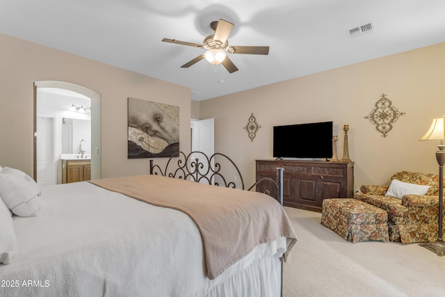 6870 S Justin Way, Chandler, AZ 85249 - carpeted bedroom with ensuite bath, a ceiling fan, and arched walkways