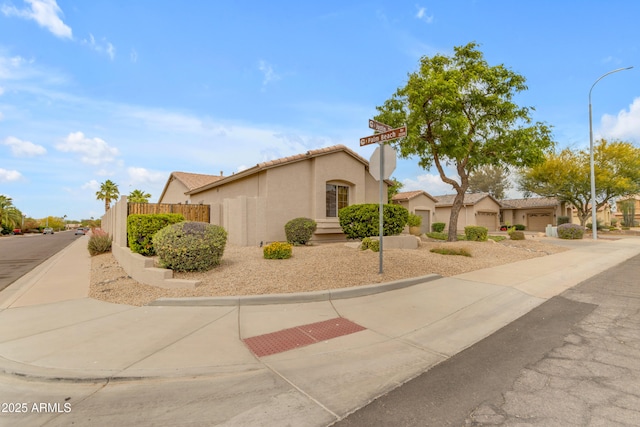 6870 S Justin Way, Chandler, AZ 85249 - view of front facade featuring stucco siding, fence, and a tiled roof