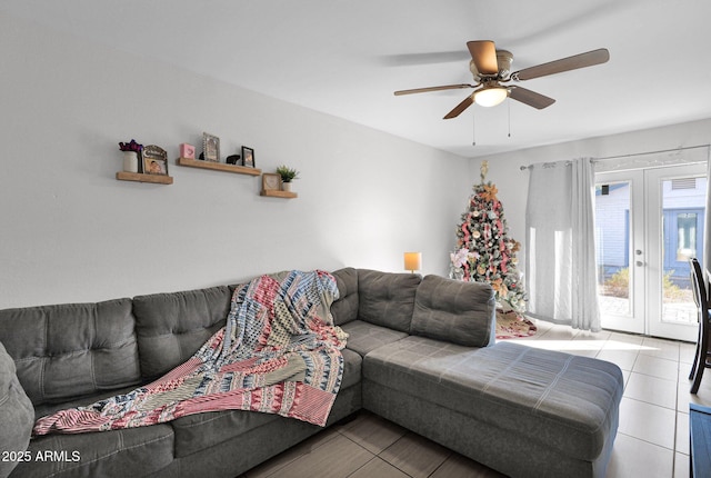 living room with ceiling fan, light tile patterned floors, and french doors