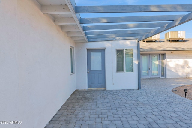 view of patio with french doors and a pergola