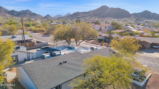 birds eye view of property with a mountain view