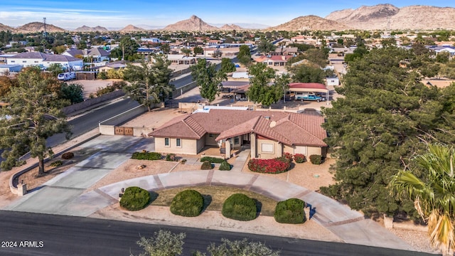 birds eye view of property with a mountain view