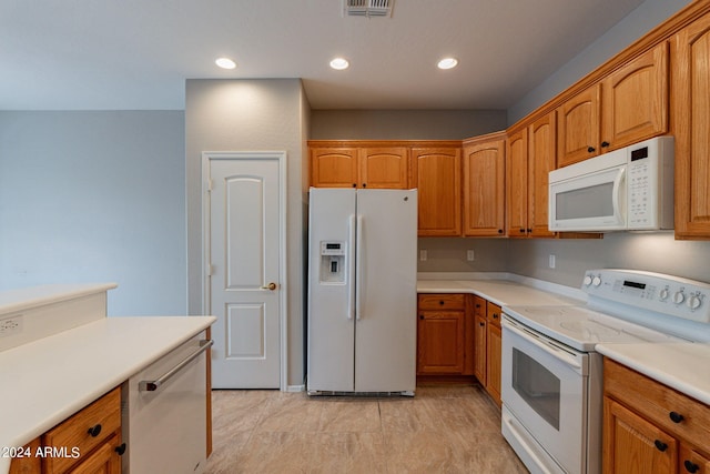 kitchen with recessed lighting, white appliances, visible vents, light countertops, and brown cabinetry