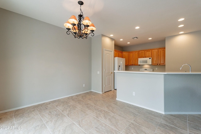 kitchen featuring recessed lighting, white appliances, visible vents, light countertops, and pendant lighting