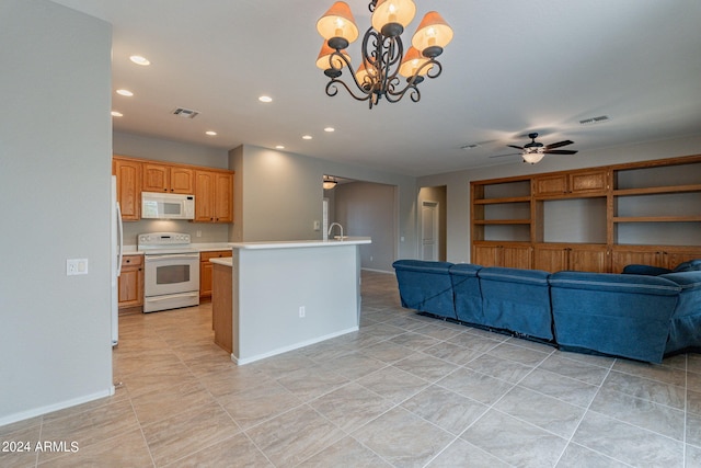 kitchen featuring white appliances, visible vents, open floor plan, light countertops, and recessed lighting