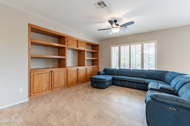 living area featuring visible vents and a ceiling fan