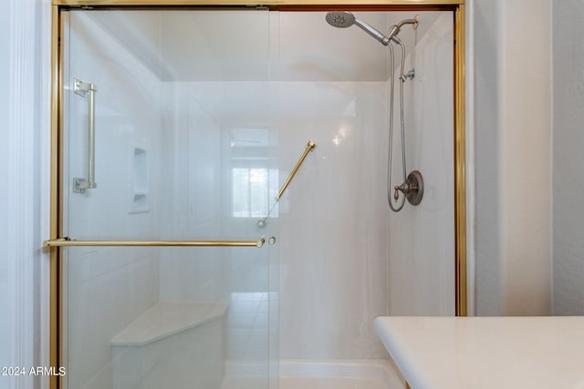 bathroom with a shower stall