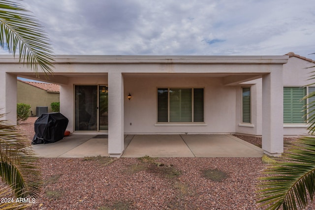 back of house with a patio area and stucco siding