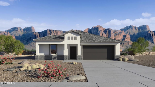 view of front of house with a mountain view, a garage, stone siding, concrete driveway, and stucco siding