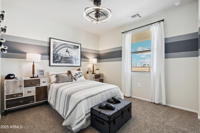 bedroom featuring visible vents, dark carpet, and baseboards