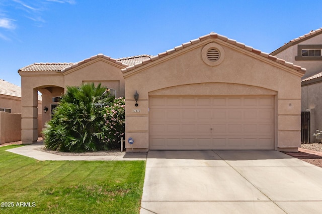 mediterranean / spanish-style house featuring stucco siding, an attached garage, driveway, and a tiled roof