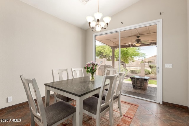 tiled dining area with baseboards, lofted ceiling, and ceiling fan with notable chandelier