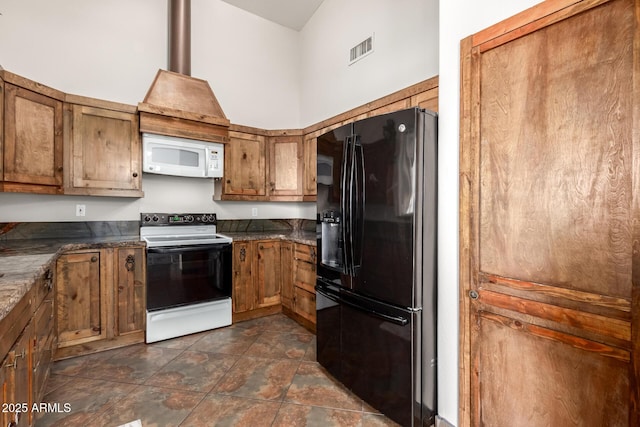 kitchen featuring range with electric cooktop, visible vents, brown cabinets, white microwave, and black refrigerator with ice dispenser