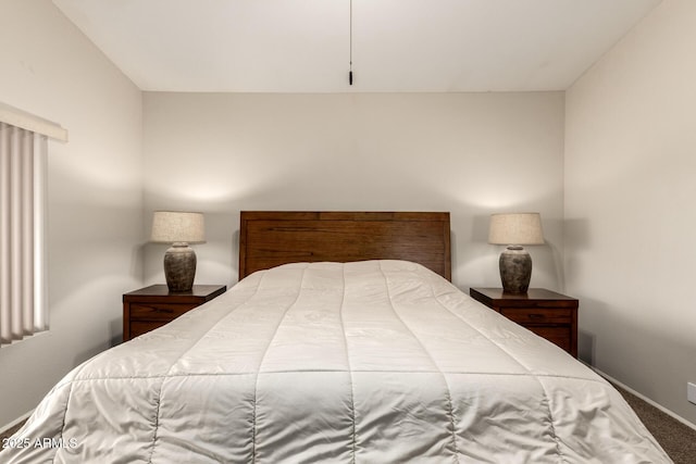 carpeted bedroom featuring baseboards