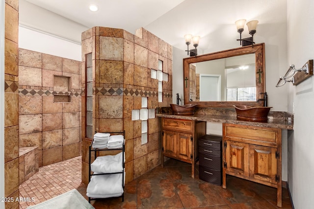 full bathroom with a walk in shower and vanity