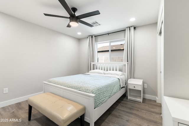 bedroom featuring baseboards, visible vents, wood finished floors, and recessed lighting
