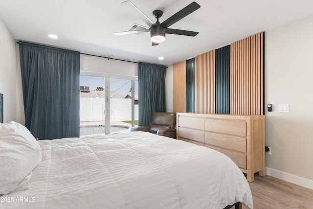 bedroom featuring baseboards, light wood finished floors, recessed lighting, and access to exterior