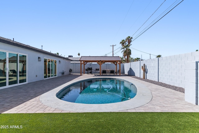 view of swimming pool with a yard, a fenced backyard, a patio, and a gazebo