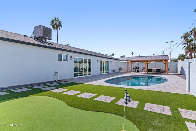 view of swimming pool with a fenced backyard, a patio, a gazebo, and central air condition unit