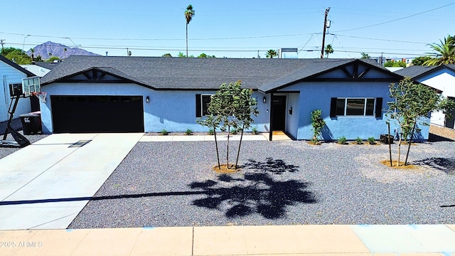 7014 E Latham St, Scottsdale, AZ 85257 - single story home with stucco siding, an attached garage, concrete driveway, and roof with shingles
