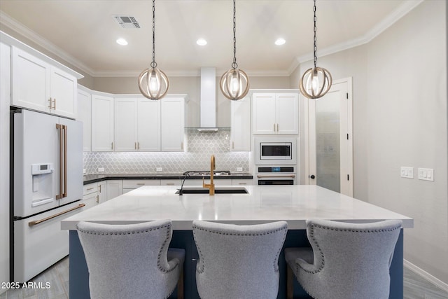 kitchen with tasteful backsplash, visible vents, crown molding, white appliances, and wall chimney exhaust hood