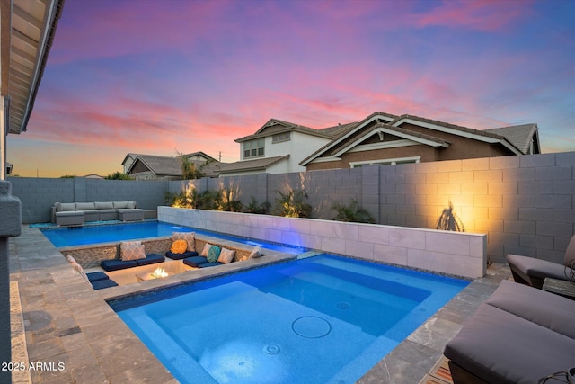 view of swimming pool featuring an outdoor living space with a fire pit, a patio area, a fenced backyard, and an in ground hot tub