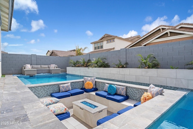 view of pool featuring an outdoor living space with a fire pit, a patio, a fenced backyard, and a fenced in pool