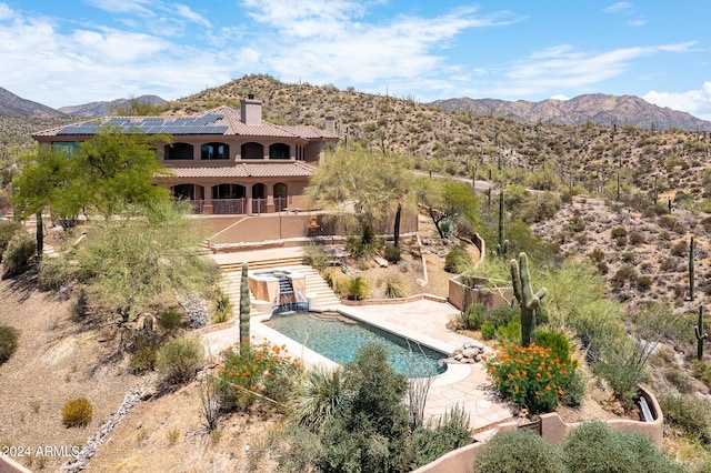 exterior space featuring a patio area and a mountain view