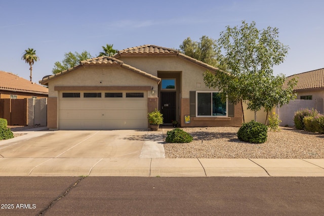 3905 E Derringer Way, Gilbert, AZ 85297 - mediterranean / spanish-style house with an attached garage, driveway, stucco siding, and a tile roof