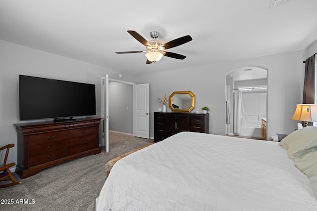 3905 E Derringer Way, Gilbert, AZ 85297 - bedroom with arched walkways, carpet floors, ceiling fan, and connected bathroom
