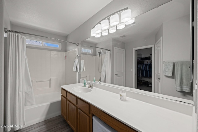 3905 E Derringer Way, Gilbert, AZ 85297 - bathroom with shower / bath combo, vanity, wood finished floors, and a walk in closet