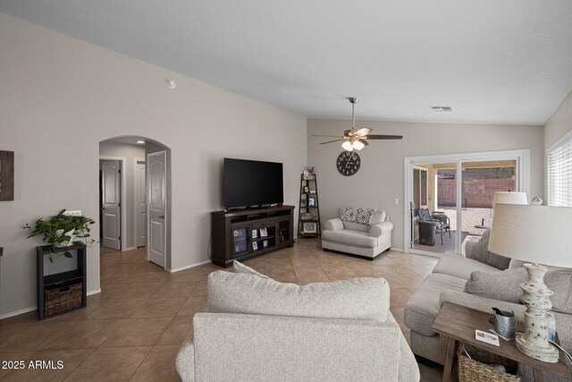 3905 E Derringer Way, Gilbert, AZ 85297 - tiled living room with vaulted ceiling, arched walkways, and ceiling fan