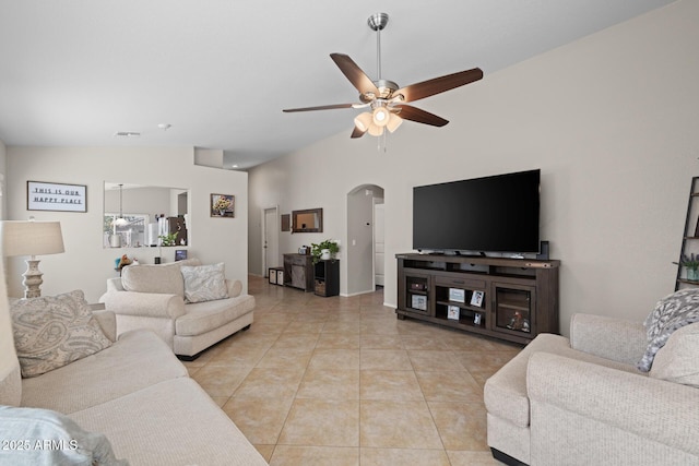 3905 E Derringer Way, Gilbert, AZ 85297 - living room featuring arched walkways, vaulted ceiling, a ceiling fan, and light tile patterned flooring