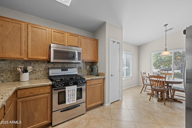 3905 E Derringer Way, Gilbert, AZ 85297 - kitchen featuring appliances with stainless steel finishes, backsplash, light tile patterned flooring, lofted ceiling, and decorative light fixtures