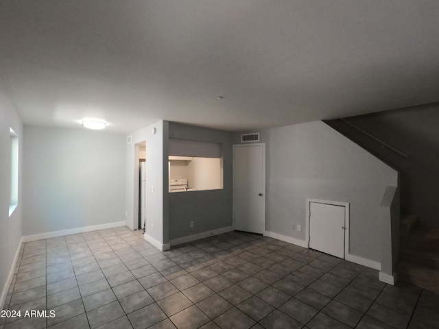 bonus room with tile patterned flooring