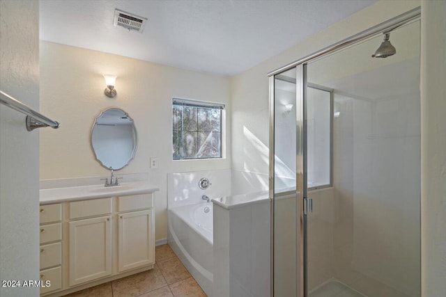 bathroom with tile patterned floors, vanity, and plus walk in shower