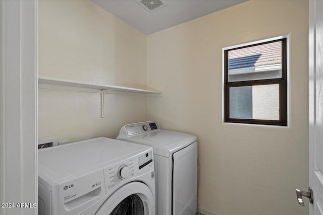 laundry area featuring independent washer and dryer