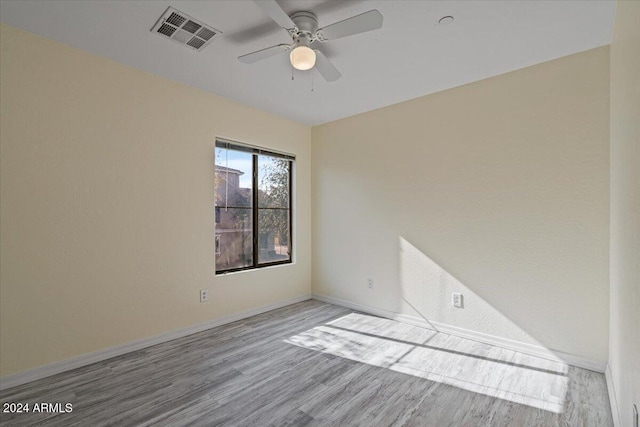 unfurnished room featuring ceiling fan and light wood-type flooring