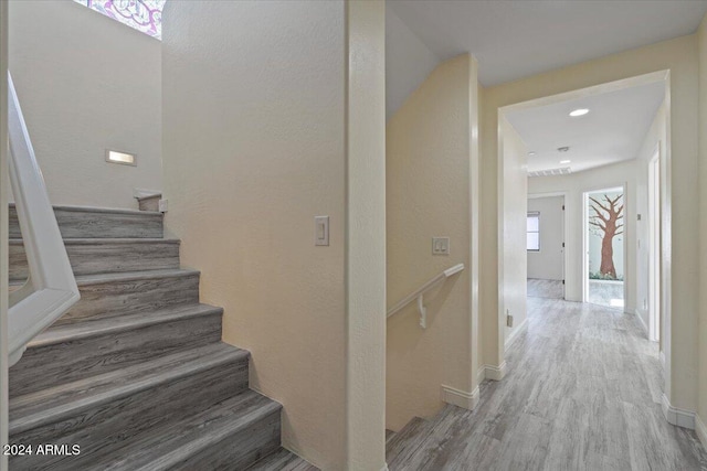 staircase featuring hardwood / wood-style flooring