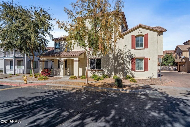 mediterranean / spanish-style home featuring a porch