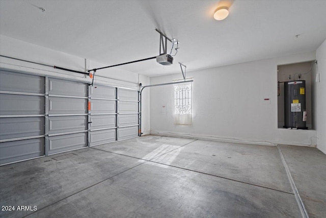 garage with electric water heater and a garage door opener