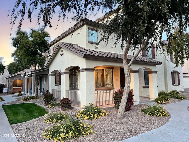 view of front of property featuring covered porch