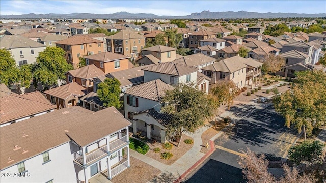 birds eye view of property with a mountain view