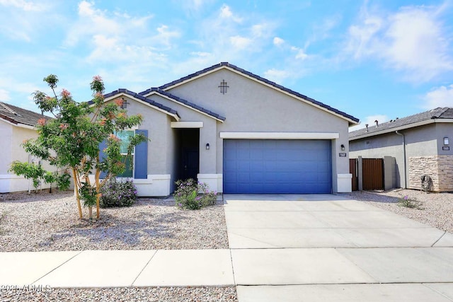 single story home featuring fence, an attached garage, driveway, and stucco siding