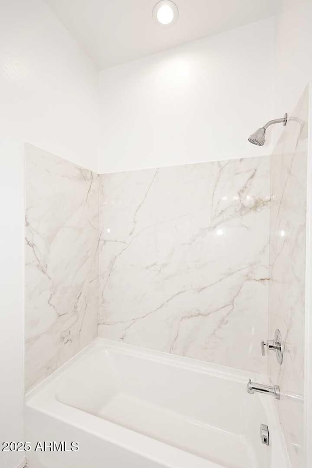 full bath featuring tub / shower combination