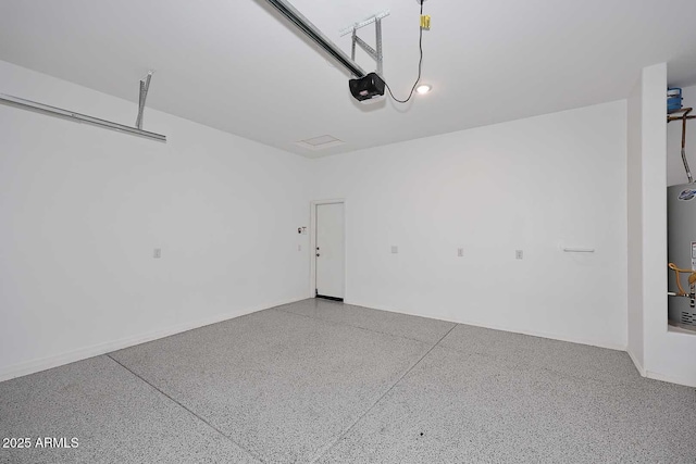 garage featuring a garage door opener and gas water heater