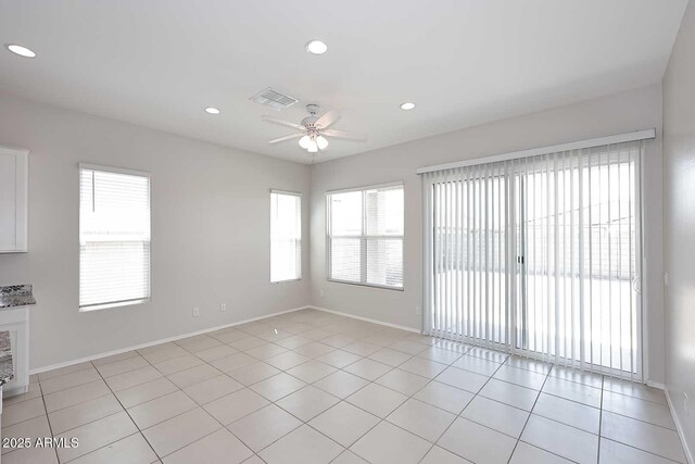 spare room featuring light tile patterned flooring, a ceiling fan, baseboards, recessed lighting, and visible vents