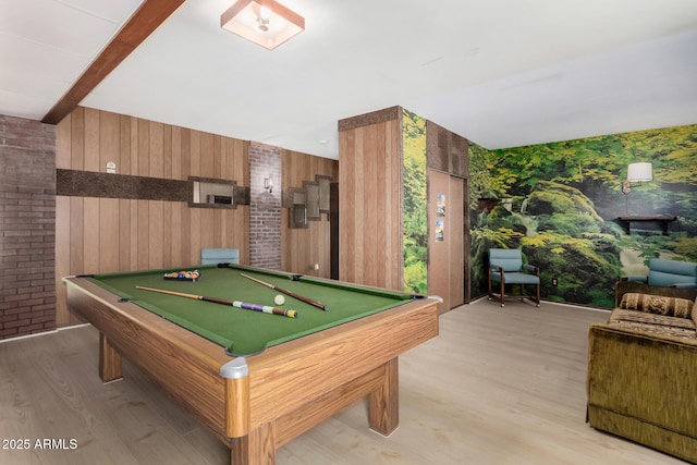 recreation room with light wood-type flooring, beam ceiling, and billiards