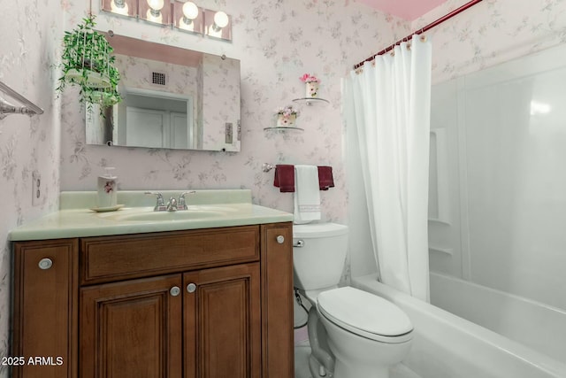 bathroom featuring toilet, wallpapered walls, visible vents, and vanity