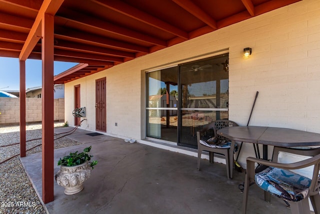 view of patio / terrace featuring outdoor dining space and fence